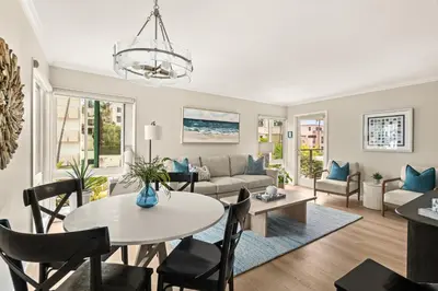 a living room with a couch and a table at Seize the Day in San Diego