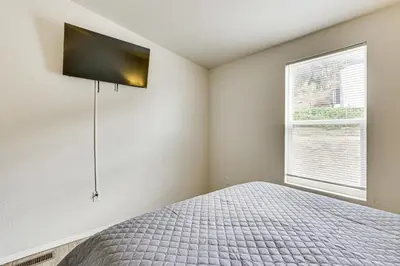 a bedroom with a bed and a window at Near Ramona Wineries Mtn-View Haven with Large Yard in Ramona