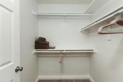a white closet with a shelf with towels on it at SoCal's Finest Gem on Dahlia in Corona del Mar