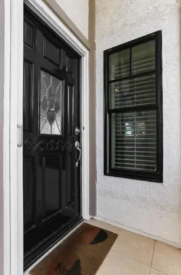 a black door with a window in a house at SoCal's Finest Gem on Dahlia in Corona del Mar