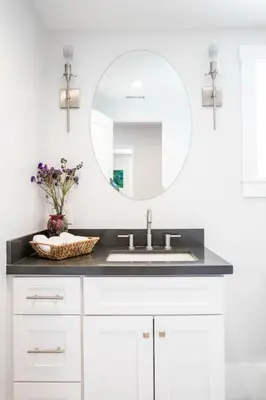 a bathroom with a sink and a mirror at A True Vacation Masterpiece in Corona del Mar