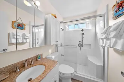 a bathroom with a sink and a toilet and a shower at Ruby Villa A - Stay for 6 in Newport Beach