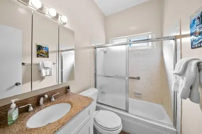 a bathroom with a shower and a sink and a toilet at Ruby Villa B - Upper Unit for 6 in Newport Beach