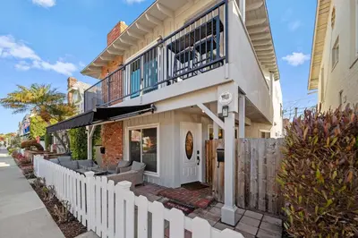 a house with a balcony on top of it at Ruby Villa B - Upper Unit for 6 in Newport Beach