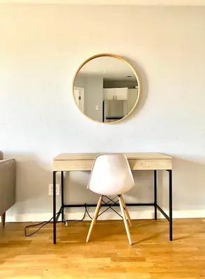 a mirror on a wall above a desk with a chair at Bright & Quiet 1-Bed Condo with Balcony in San Diego