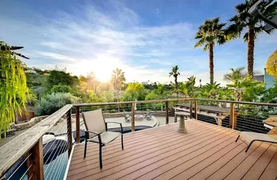 a deck with two chairs and a view of the ocean at Serene hillside oasis with pool - 20 min to beach in Oceanside