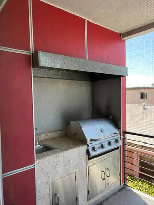 an outdoor kitchen with a stove and a sink at Cozy North Park Townhome in San Diego