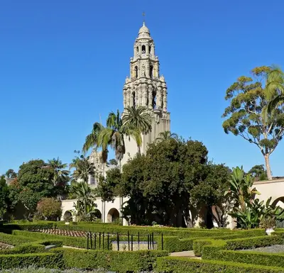 a building with a clock tower in a park at Cozy North Park Townhome in San Diego