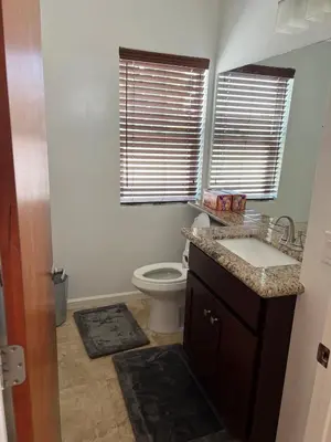 a bathroom with a sink and a toilet at Cozy North Park Townhome in San Diego