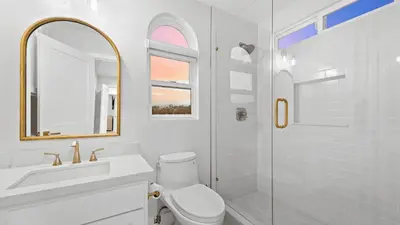 a bathroom with a toilet and a sink and a shower at Backyard Oasis w Fire Table Walk to Salt Creek Beach Dana Point Dreams in Dana Point