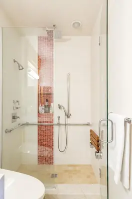 a bathroom with a shower with a glass door at Luxe Family Villa ,116 inch Theater, Yard , Near Beaches in San Diego