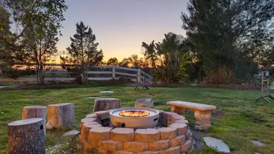 a fire pit in the middle of a field at Temecula Wine Country Home w Pool Hot Tub Game Room Vineyard Views in Country Road Estates