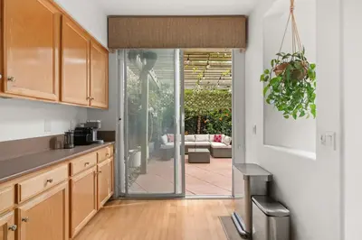 a kitchen with a sliding glass door to a patio at Sweet Serenity 3 bed with community pool, spa in Encinitas