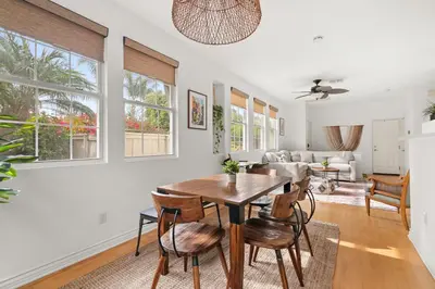 a dining room and living room with a table and chairs at Sweet Serenity 3 bed with community pool, spa in Encinitas