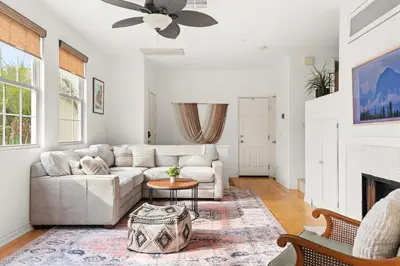 a living room with a couch and a fireplace at Sweet Serenity 3 bed with community pool, spa in Encinitas