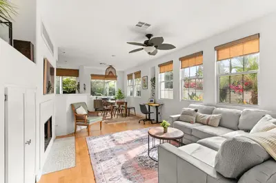 a living room with a couch and a fireplace at Sweet Serenity 3 bed with community pool, spa in Encinitas