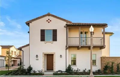 a large white house with a balcony at Hidden Gem New 4B3B House UCI Disney Amazing view in Irvine
