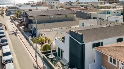 an aerial view of a city with buildings at Steps from the SandBoardwalk Outdoor Dining Parking and Patio in Newport in Newport Beach