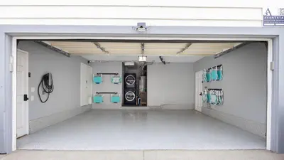 a garage with an open door with washing machines at Coastal-Chic Newport Stay Steps to the Beach Dining Boardwalk Optional Add-On Unit in Newport Beach