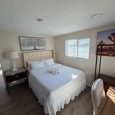 a bedroom with a bed with two glasses on it at Suite Steps to San Diego Top Spots in San Diego