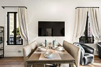 a dining room with a wooden table and chairs at The Artifact Hotel in San Diego