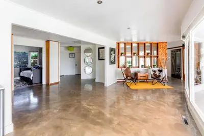 an empty living room with a couch and a table at Scenic View Estate with Pool & Hot Tub in San Diego