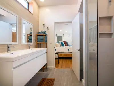 a bathroom with a sink and a mirror at La Jolla Condo Oceanview, Zen and Coastal Charm in San Diego