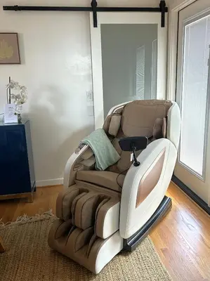 a reclining chair in a living room with a television at La Jolla Condo Oceanview, Zen and Coastal Charm in San Diego