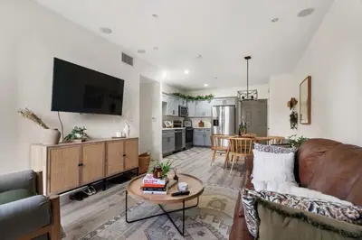 a living room with a couch and a table at Down Town Condo with gym pool BBQ jacuzzi in San Diego