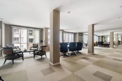 a conference room with chairs and tables and windows at Down Town Condo with gym pool BBQ jacuzzi in San Diego