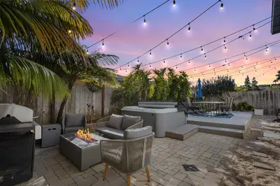 a patio with couches and a fire pit and lights at Hidden Gem 3Bed 3Ba Retreat Jacuzzi AC Balconies in San Diego