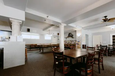 a dining room with a table and chairs at Tamarack Beach Hotel in Carlsbad