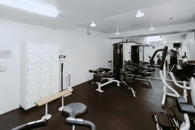 a gym with several treadmills and cardio machines at Tamarack Beach Hotel in Carlsbad