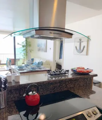 a kitchen with a counter with a stove top oven at Sunset Cliffs Oceanfront Oasis, San Diego - Stunning Views & Ocean Sounds in San Diego