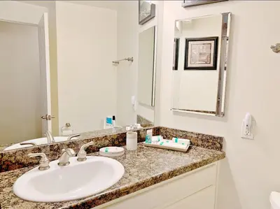 a bathroom with a sink and a mirror at Sunset Cliffs Oceanfront Oasis, San Diego - Stunning Views & Ocean Sounds in San Diego
