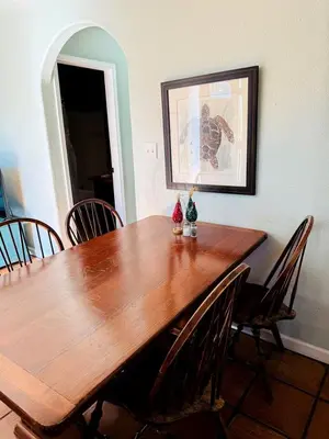 a wooden table in a room with chairs around it at Pet Friendly Breathtaking Cottage with Great Views and Hot-tub in Rainbow, California in Fallbrook