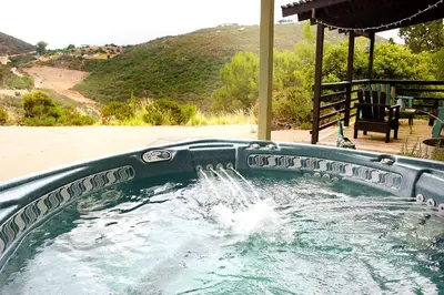a plunge pool with water pouring into it at Pet Friendly Fantastic Cottage with Hot-tub in Rainbow, California in Fallbrook