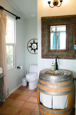 a bathroom with a barrel sink and a toilet at Pet Friendly Charming Cottage with Incredible Views and Hot-tub in Rainbow, California in Fallbrook