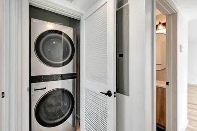 two washer and dryer machines in a room at Steps to the Beach in Imperial Beach