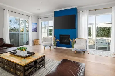 a living room with a blue accent wall at Large 4 Bedroom Close To Beach in Encinitas