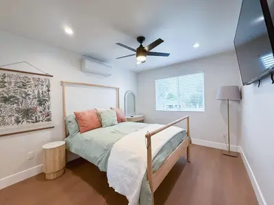 a bedroom with a bed and a ceiling fan at Lime Light La Mesa New 4BR 3BA Group Friendly in La Mesa