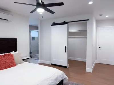 a bedroom with a bed and a ceiling fan at Lime Light La Mesa New 4BR 3BA Group Friendly in La Mesa
