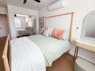 a bedroom with a large bed and a window at Lime Light La Mesa New 4BR 3BA Group Friendly in La Mesa