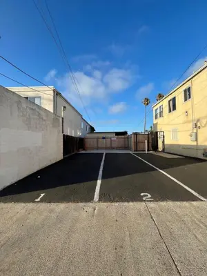 an empty parking lot in front of a building at 2BD Sashas Bungalow Beach Vibes 1 Block Away in San Diego
