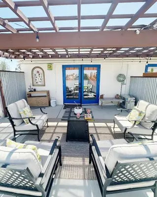 a large patio with chairs and a table at Colorful Casita Frida 1BD Retreat by Balboa Park in San Diego