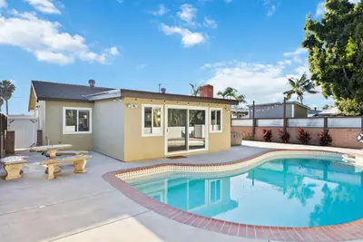 a house with a swimming pool and a patio at NEW Cozy Zen Pool Jacuzzi Home Heart of San Diego in San Diego