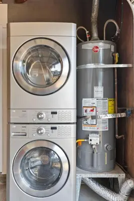 two washing machines and a washer and dryer in a room at NEW Cozy Zen Pool Jacuzzi Home Heart of San Diego in San Diego
