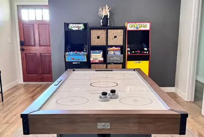 a ping pong table in the middle of a room at NEW Cozy Zen Pool Jacuzzi Home Heart of San Diego in San Diego