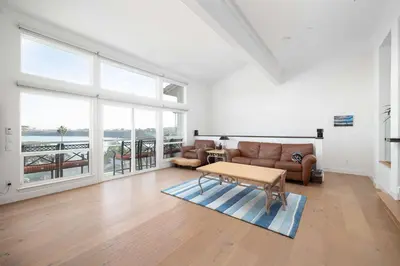 a living room with a couch and a table at Water Views on Every Floor for this multi Holiday Home - Walk to the Beach in Carlsbad