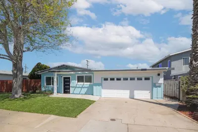 a house with a blue and white garage at 4 Miles to Beach Central and Newly Renovated in San Diego